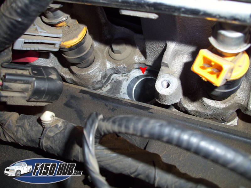 How would you remove a spark plug on a Ford?