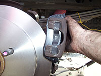 Reinstalling rear brake caliper